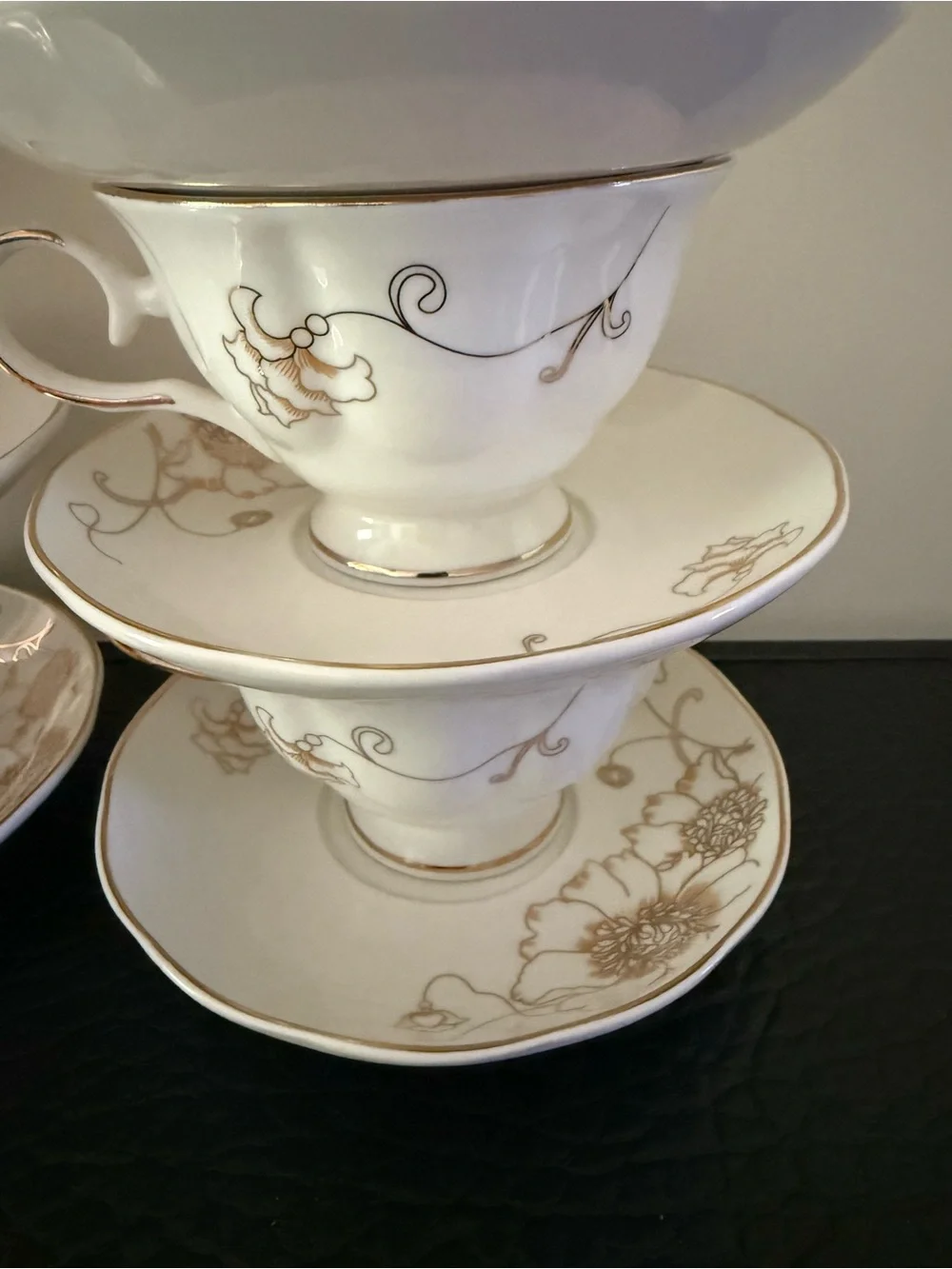Set Of 6 cup and saucer feature the gold overglaze monogram White porcelain body